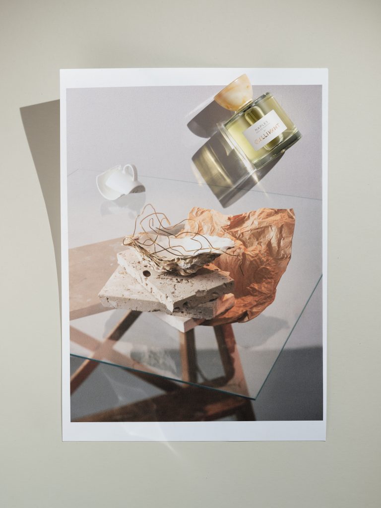 Gallivant perfume photographed on top of a photographic print.