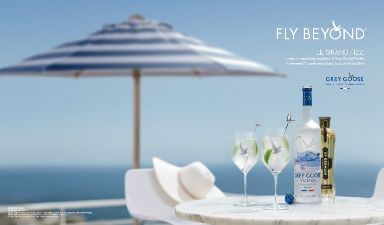 Grey Goose cocktails on table with parasol and sea view, Cape Town location shoot
