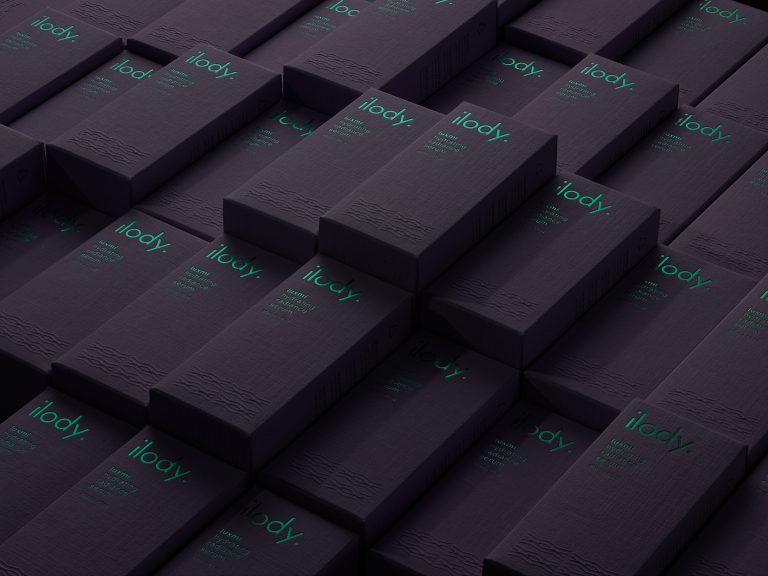 Ilody skincare boxes in deep purple tones arranged in layered formation