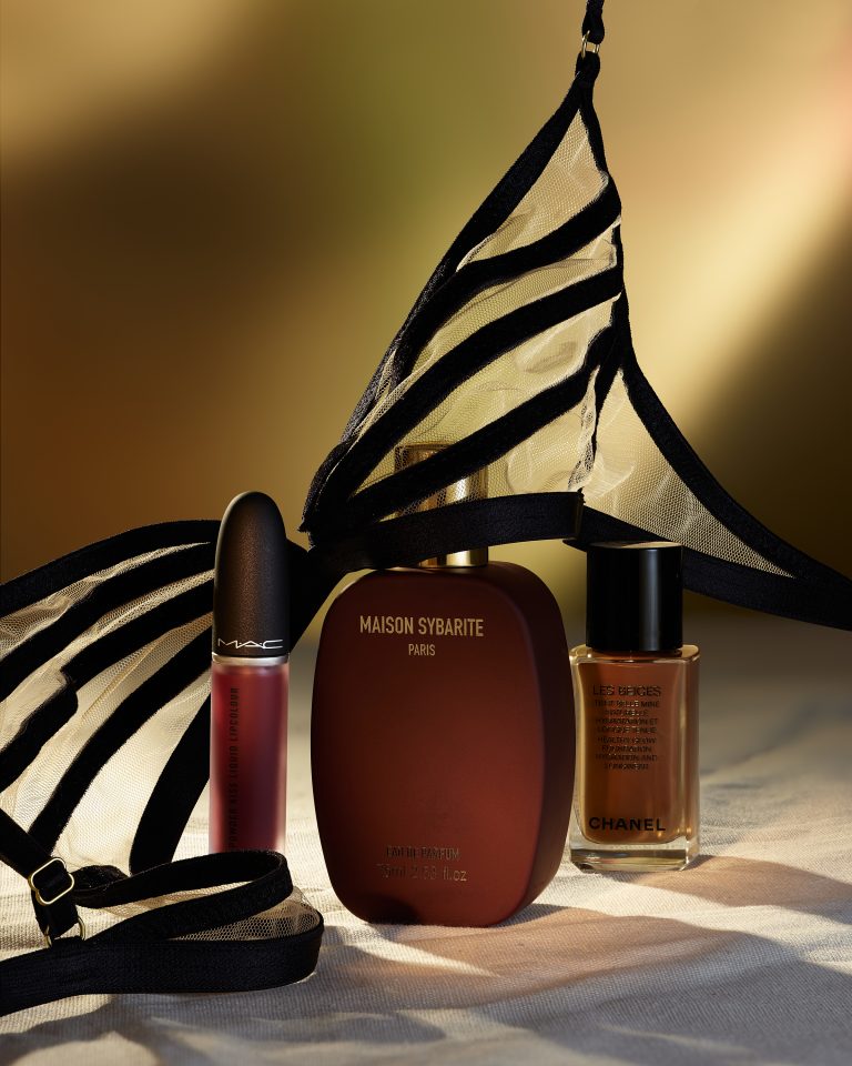 Editorial shoot for 1883 magazine featuring make-up and beauty products. MAC cosmetics lip product and nail polish arranged with graphic fabric backdrop