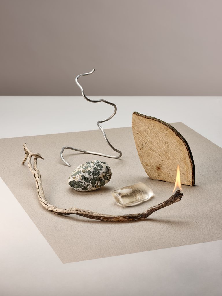 Ooho edible water sphere presented with natural materials in minimal still life