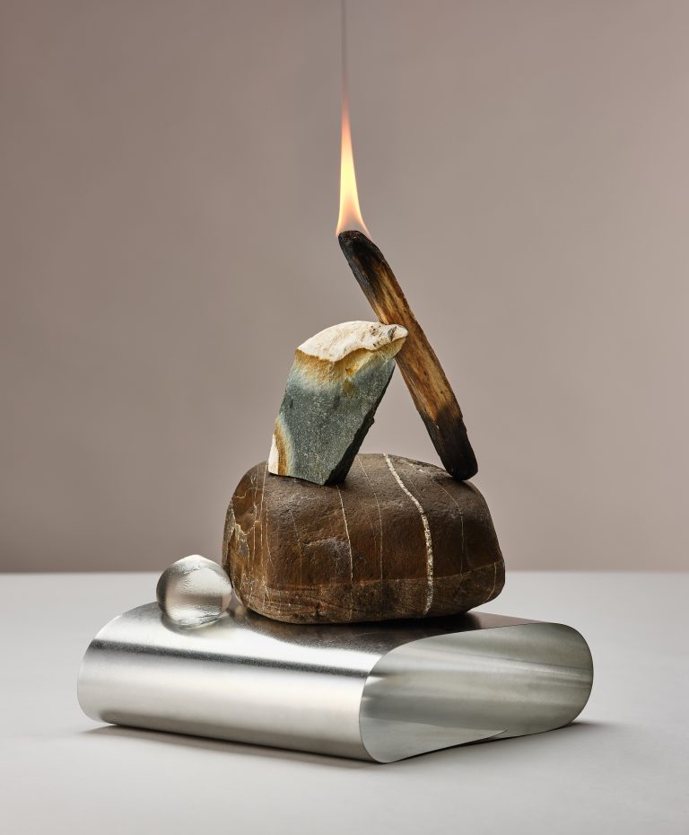 Ooho sustainable packaging displayed in sculptural still life with flame detail