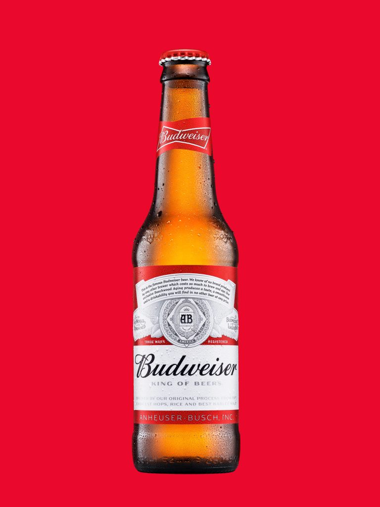 Budweiser beer bottle on red background, commercial still life photography