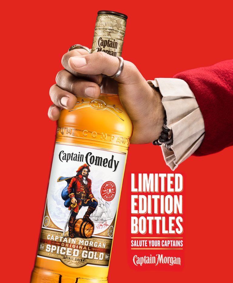 Captain Morgan spiced rum bottle held in costumed Pirate hand with campaign text on red background