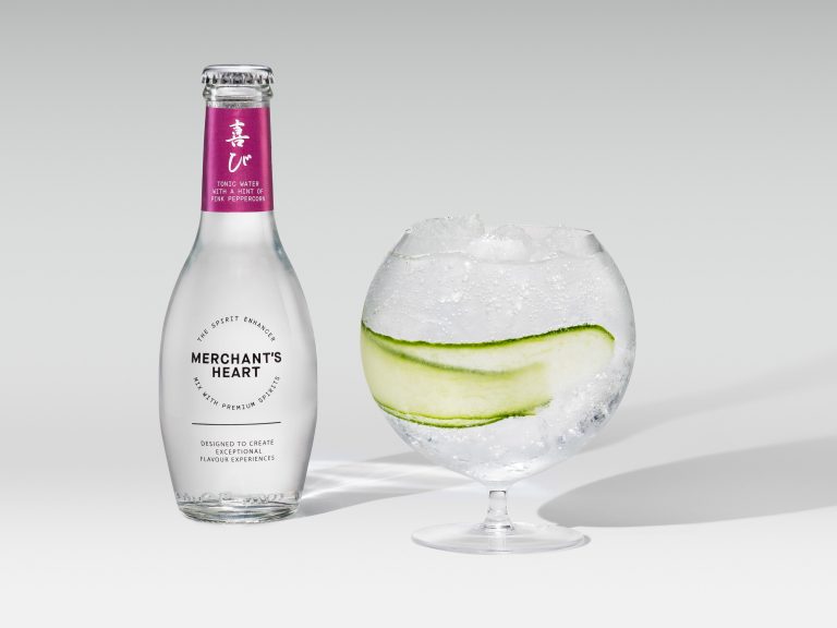 Merchant’s Heart bottle with round glass and cucumber garnish