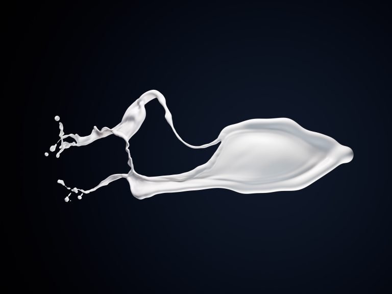 White liquid splash on dark background, monochrome studio composition