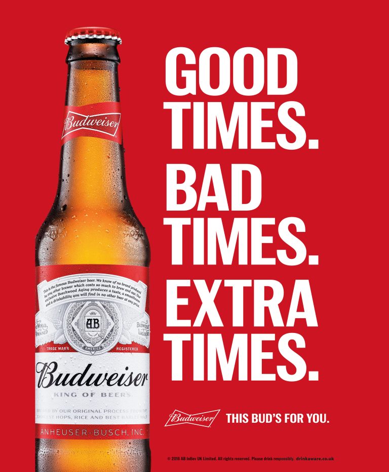 Budweiser bottle with campaign typography on red background, outdoor advertising visual